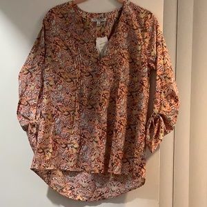 NWT Notations Medium  v-neck blouse with button pull backs on sleeves.